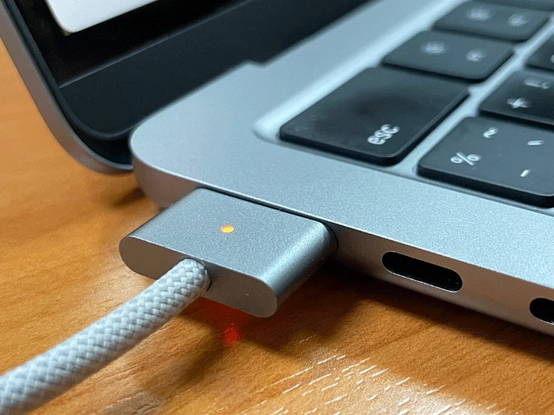 A Mac charger shows plug and connect interaction.